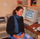 2001, A client next to her computer which was supplied, installed and maintained at an estate in South Africa